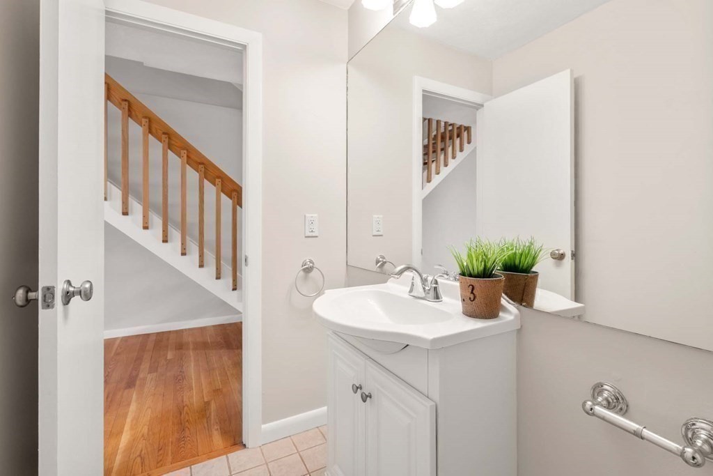 120 Beaconsfield Road, Unit 9 Brookline, MA 02445 - Photo 15 of 20 a bathroom with a sink and a mirror