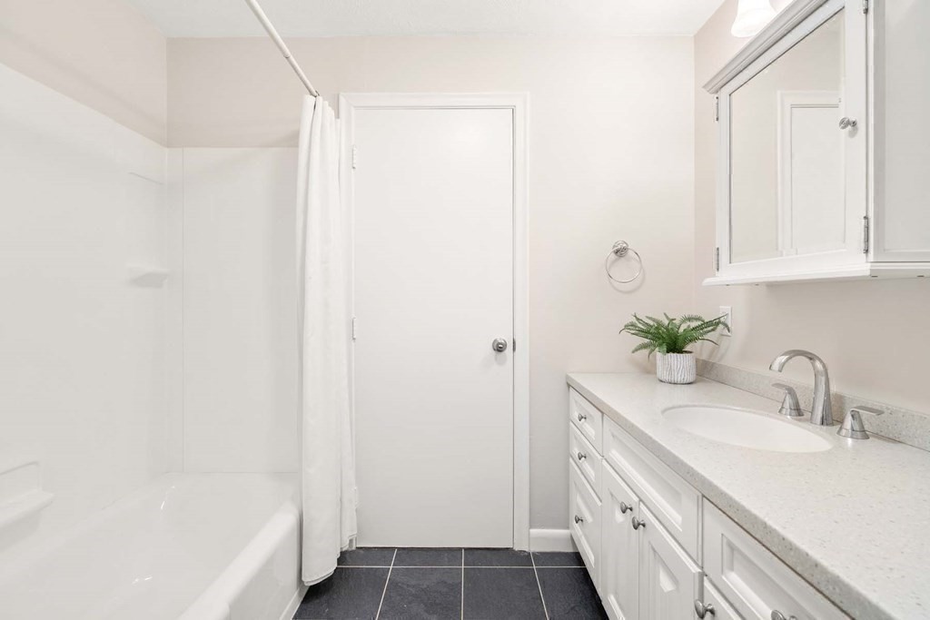 120 Beaconsfield Road, Unit 9 Brookline, MA 02445 - Photo 16 of 20 a bathroom with a sink and a mirror