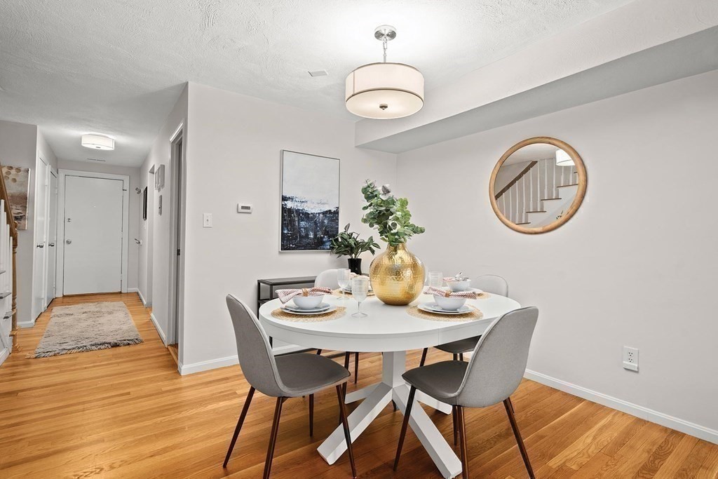 120 Beaconsfield Road, Unit 9 Brookline, MA 02445 - Photo 4 of 20 a dining room with furniture and wooden floor