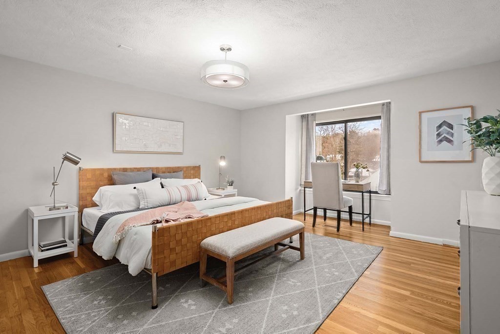 120 Beaconsfield Road, Unit 9 Brookline, MA 02445 - Photo 10 of 20 a bedroom with a bed and a table