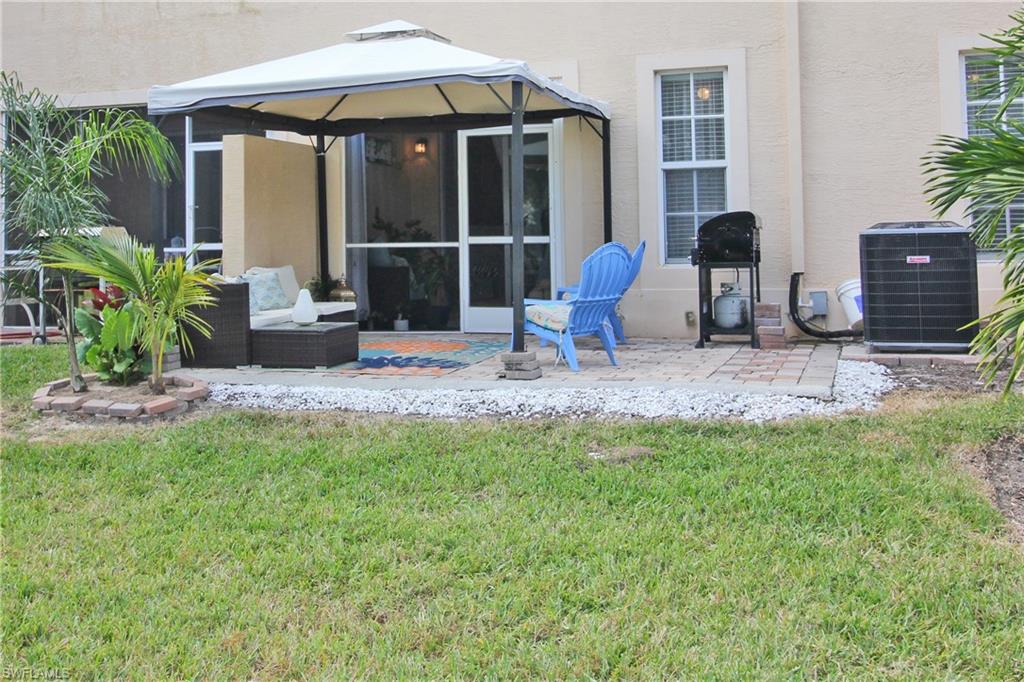 3970 Cherrybrook Loop Fort Myers, FL 33966 - Photo 16 of 21 a backyard of a house with seating space
