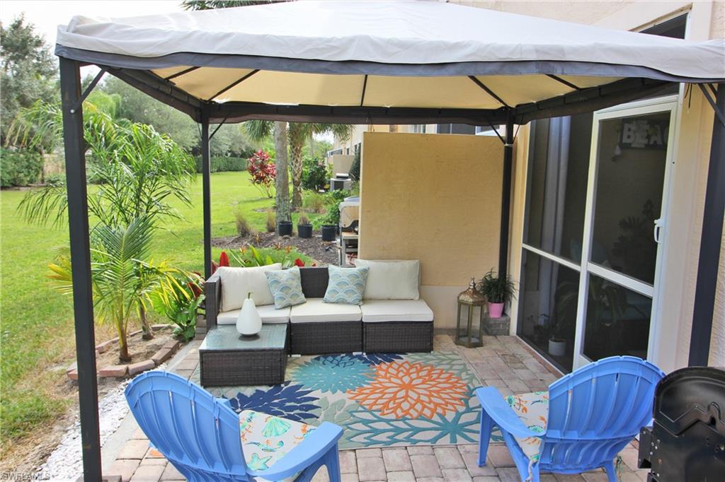 3970 Cherrybrook Loop Fort Myers, FL 33966 - Photo 17 of 21 a outdoor living space with furniture and garden view