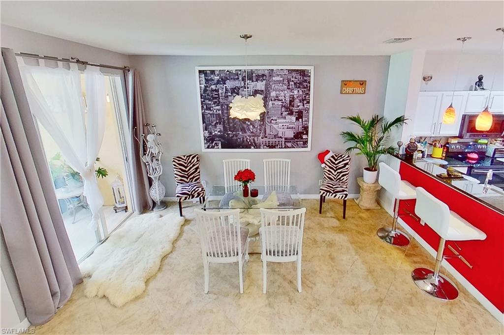 3970 Cherrybrook Loop Fort Myers, FL 33966 - Photo 8 of 21 a view of a dining room with furniture and a potted plant