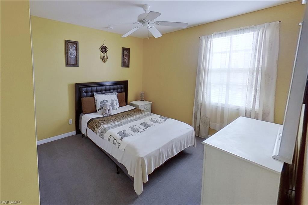 3970 Cherrybrook Loop Fort Myers, FL 33966 - Photo 9 of 21 a bedroom with a bed and a window