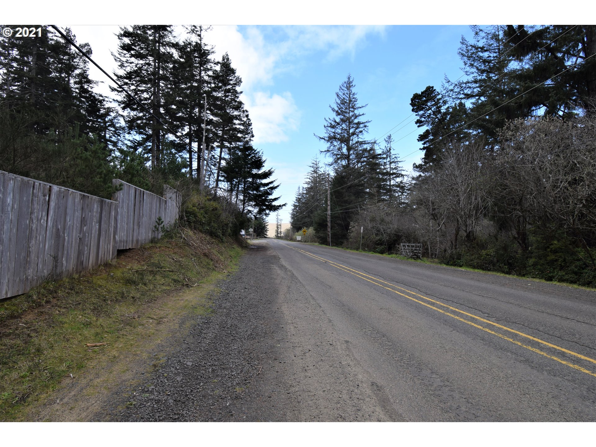 67071 Spinreel Road North Bend, OR 97459 - Photo 11 of 13 a view of a yard with wooden fence