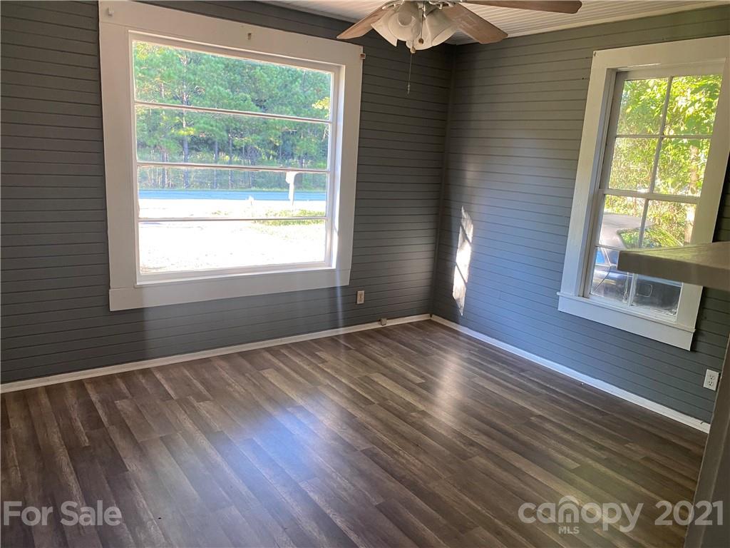 531 Old Dixie Road Lancaster, SC 29720 - Photo 6 of 44 a view of an empty room with wooden floor and a window