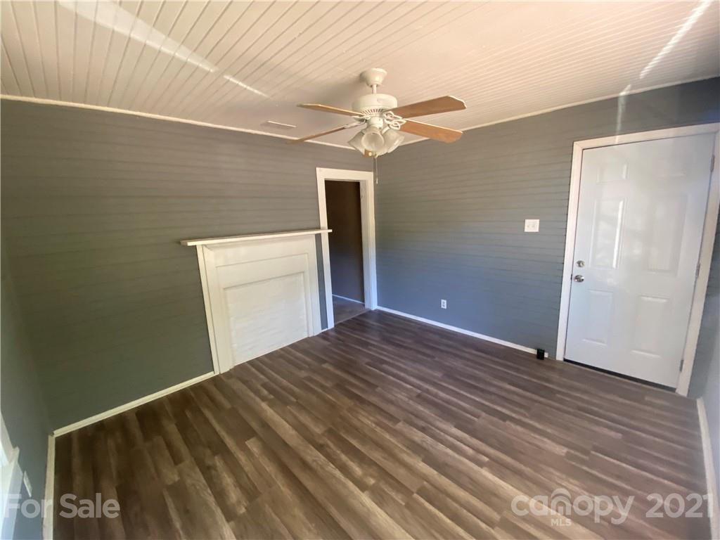 531 Old Dixie Road Lancaster, SC 29720 - Photo 7 of 44 a view of a livingroom with wooden floor and a ceiling fan