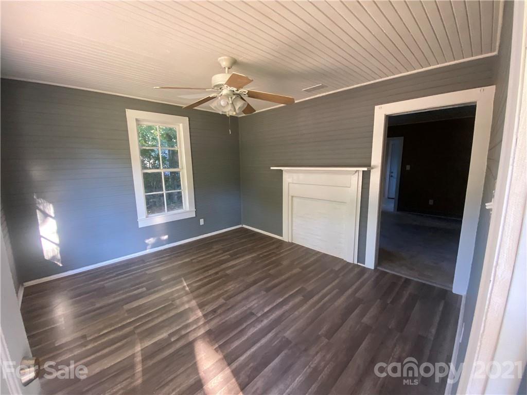 531 Old Dixie Road Lancaster, SC 29720 - Photo 8 of 44 an empty room with wooden floor cabinet and windows