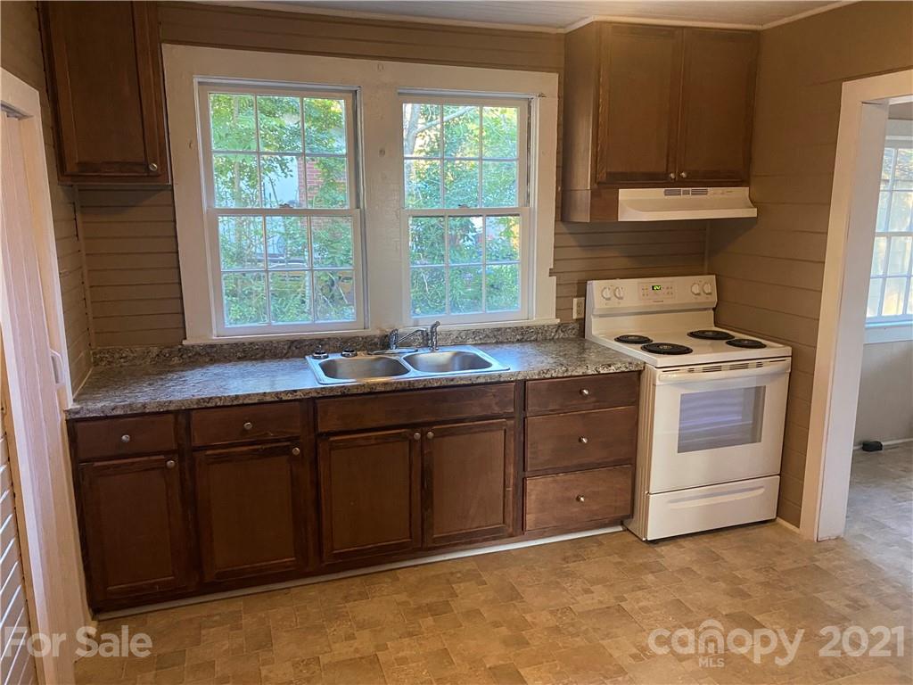 531 Old Dixie Road Lancaster, SC 29720 - Photo 9 of 44 a kitchen with granite countertop a sink cabinets stainless steel appliances and a window