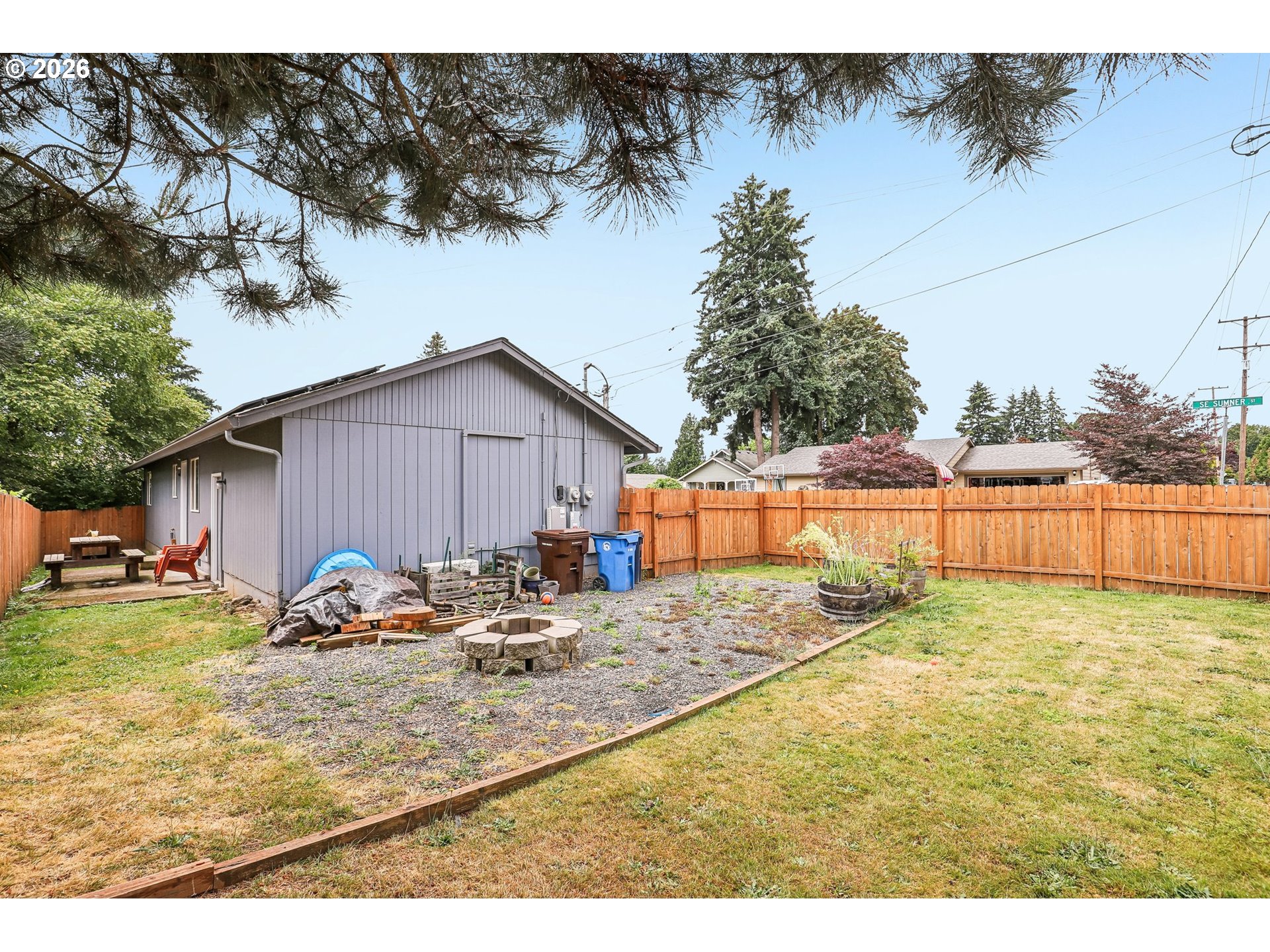 608 Southeast Sumner Street Camas, WA 98607 - Photo 26 of 39 a backyard of a house with table and chairs
