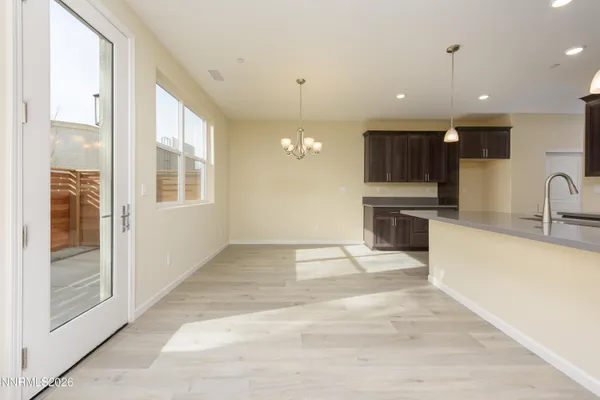 a view of a kitchen with a sink and a microwave