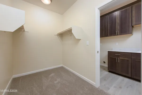 a view of an empty room with cabinet
