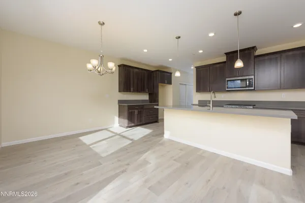 a view of kitchen with microwave and stove