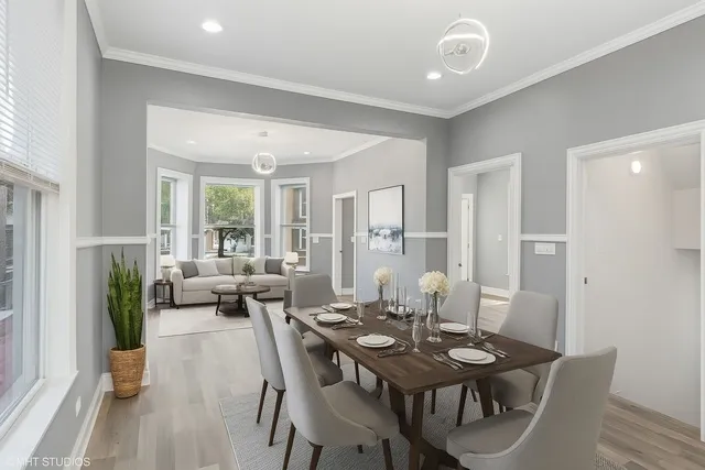a view of a dining room with furniture and wooden floor