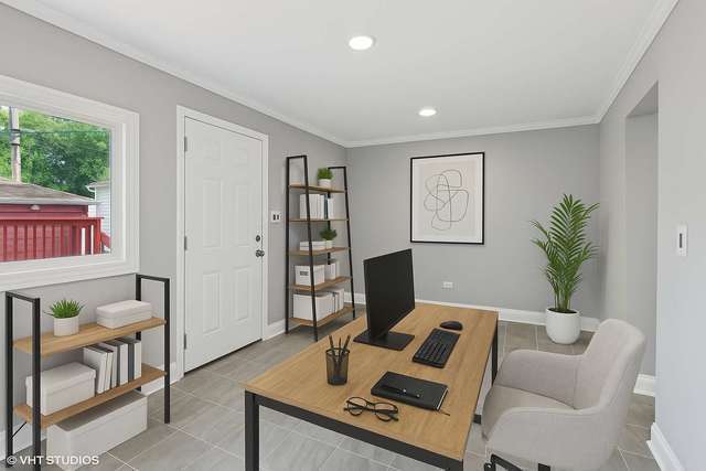 642 East 90th Street Chicago, IL 60619 - Photo 5 of 13 a living room with furniture and a flat screen tv