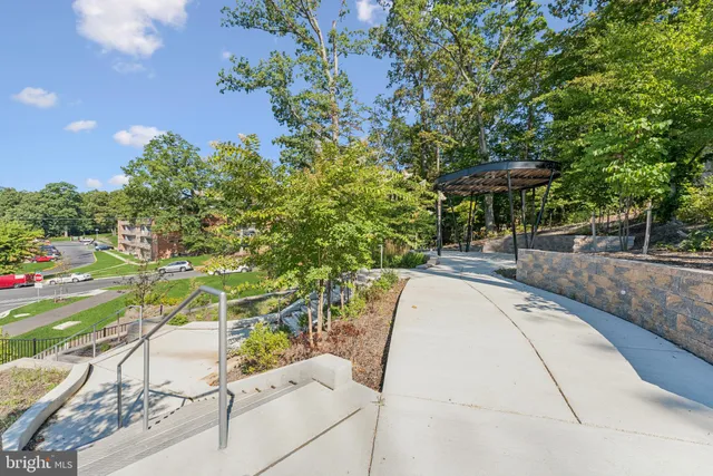 a view of swimming pool with a bench