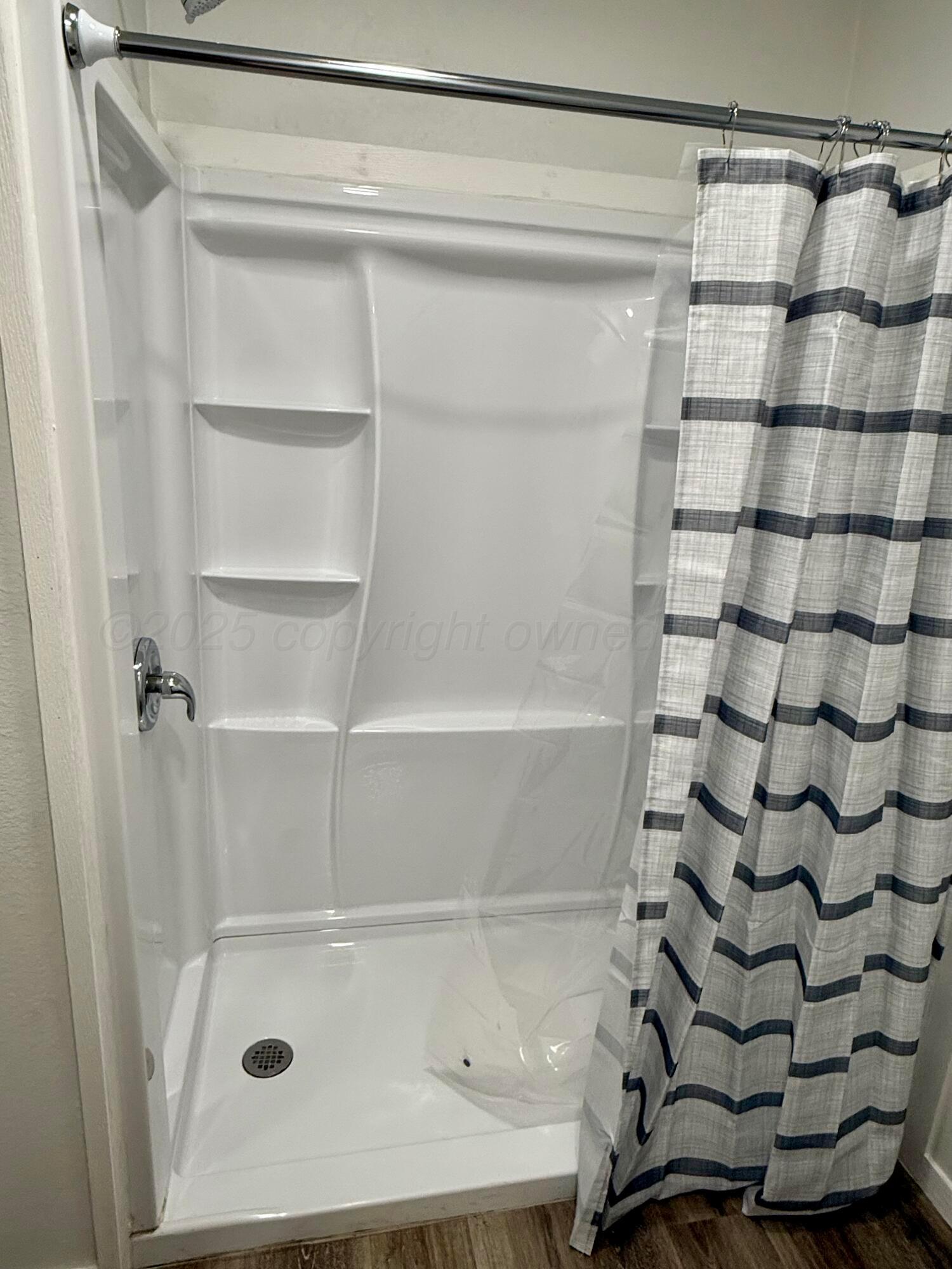 1303 Boyd Street Borger, TX 79007 - Photo 13 of 19 a bathroom with a shower