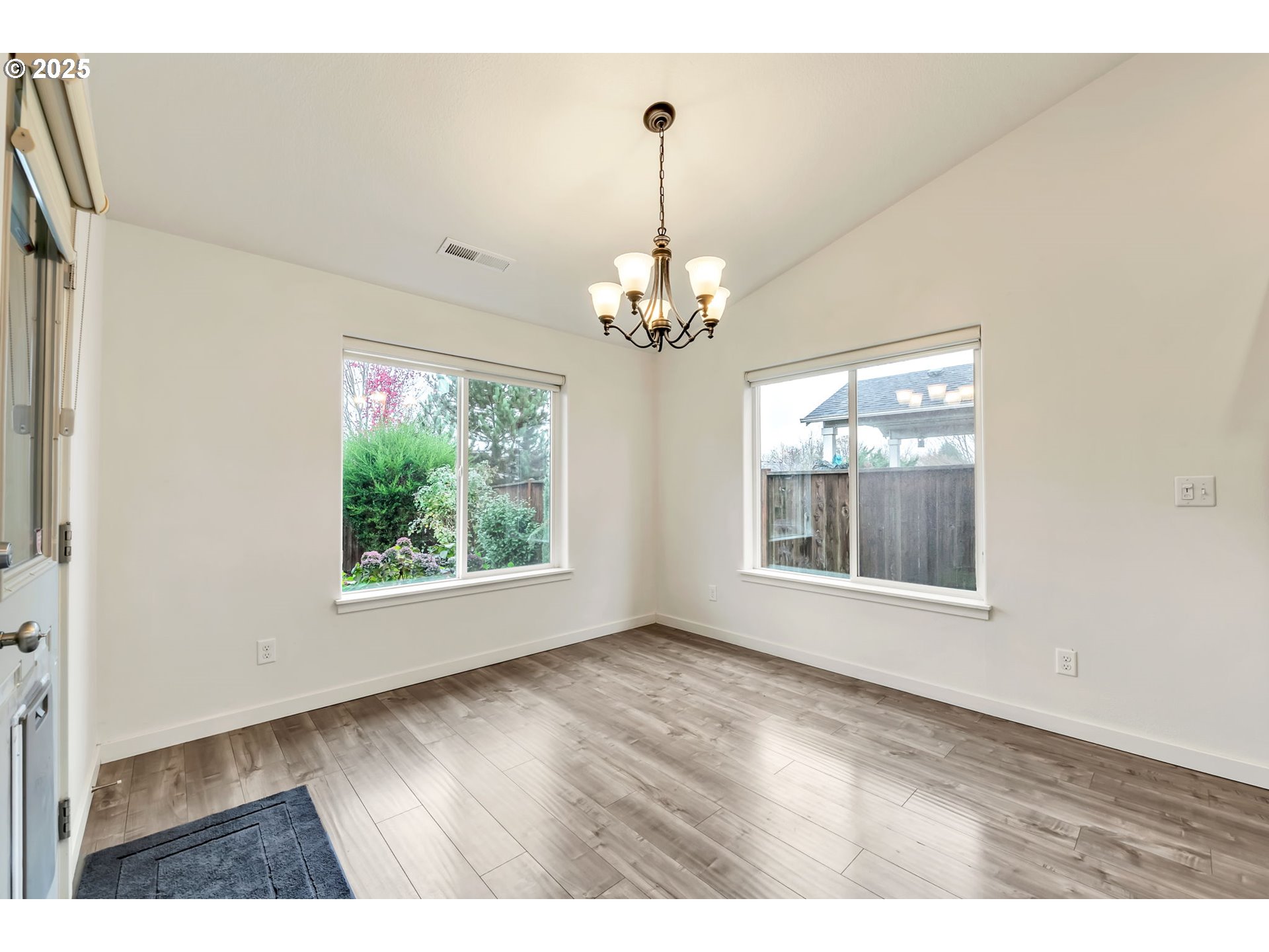 3869 Gusty Avenue Northeast Albany, OR 97322 - Photo 11 of 47 a view of an empty room with wooden floor and a window