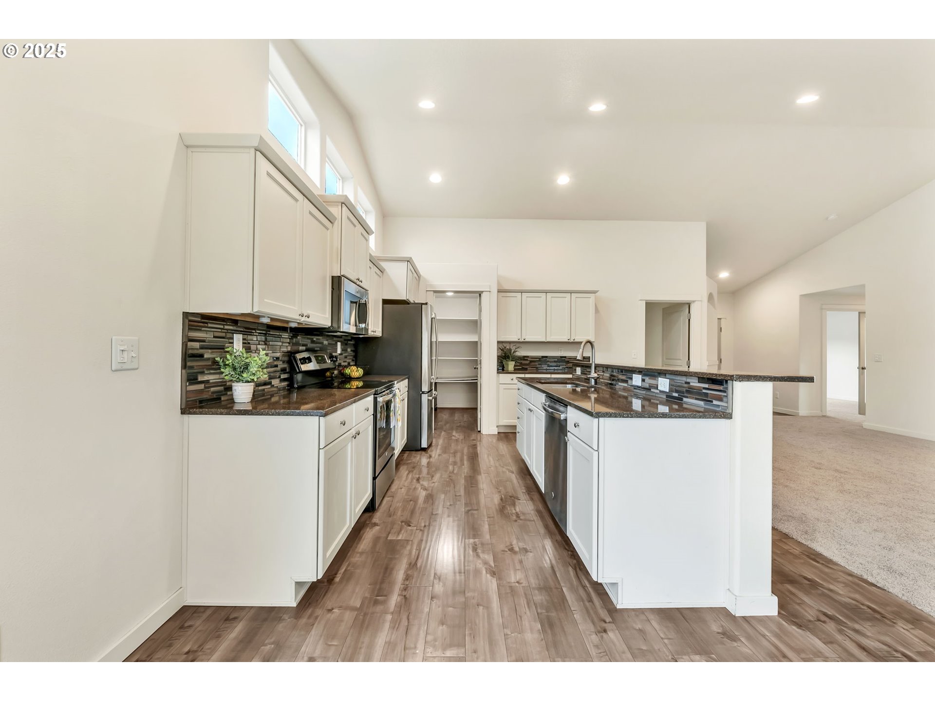 3869 Gusty Avenue Northeast Albany, OR 97322 - Photo 12 of 47 a kitchen with stainless steel appliances a refrigerator and a stove