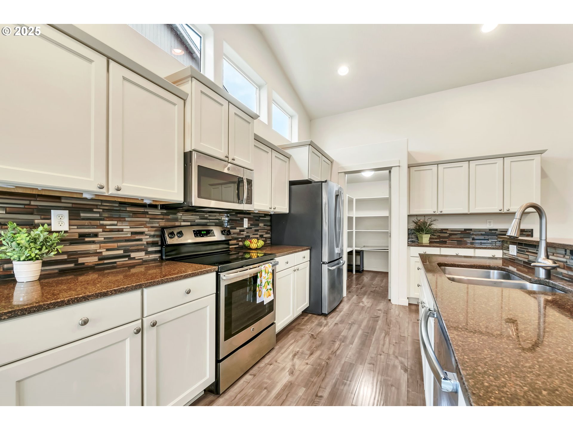 3869 Gusty Avenue Northeast Albany, OR 97322 - Photo 13 of 47 a kitchen with stainless steel appliances granite countertop a stove a sink dishwasher and a refrigerator