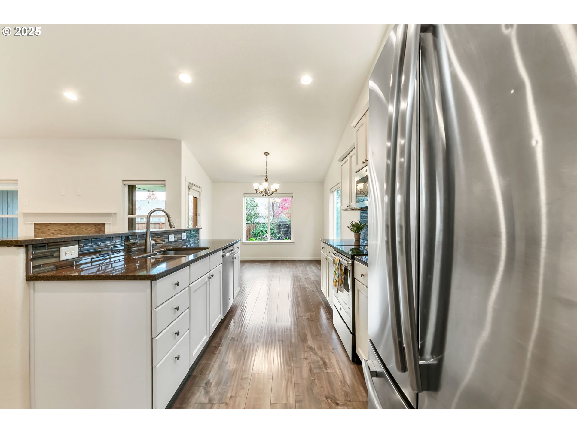 3869 Gusty Avenue Northeast Albany, OR 97322 - Photo 16 of 47 a kitchen with stainless steel appliances granite countertop a refrigerator and a sink