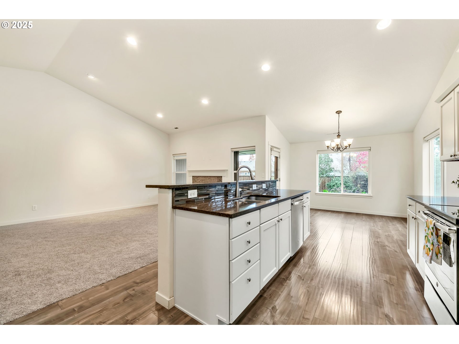 3869 Gusty Avenue Northeast Albany, OR 97322 - Photo 17 of 47 a kitchen with stainless steel appliances granite countertop a stove and a sink