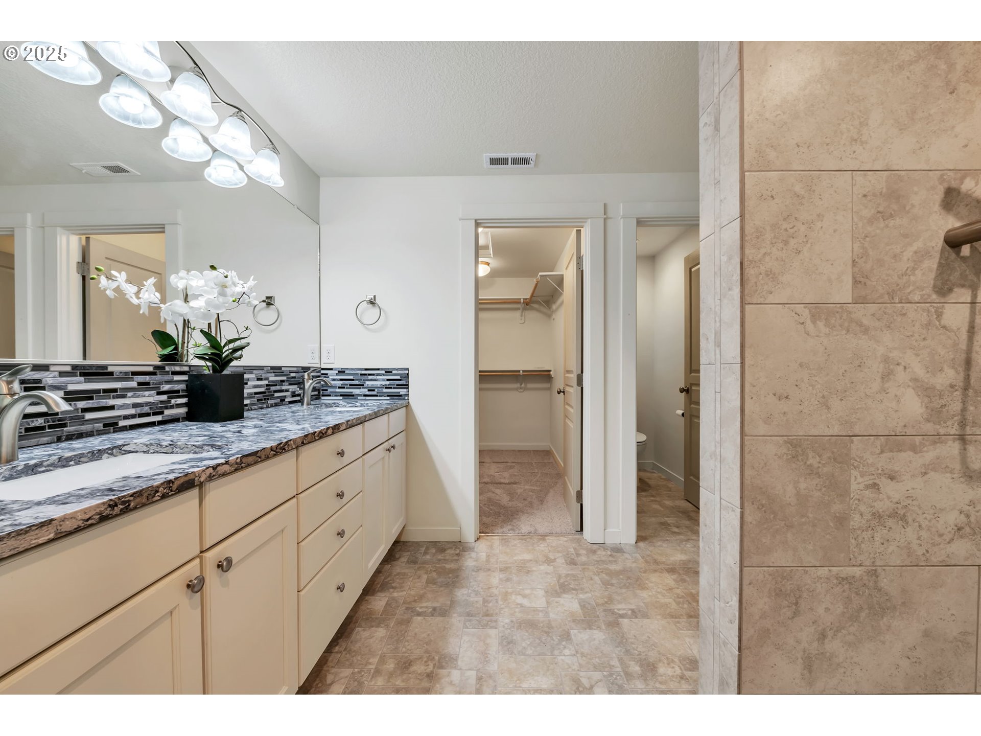 3869 Gusty Avenue Northeast Albany, OR 97322 - Photo 34 of 47 a bathroom with a granite countertop sink a mirror and a shower