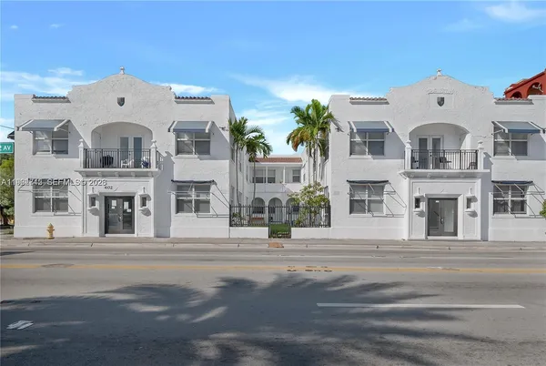 a large white building with a white door