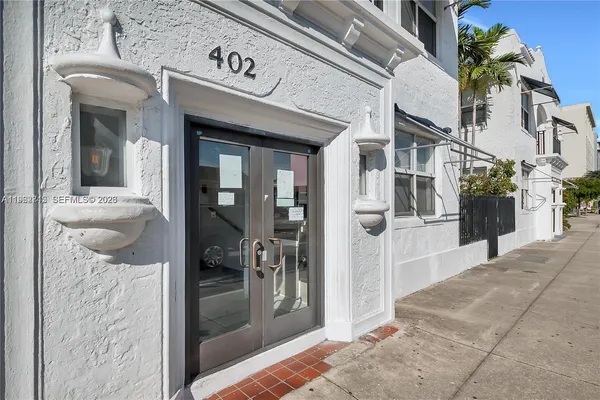 a view of a hallway with a outdoor space