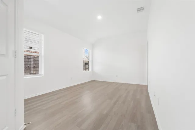 a bathroom with a bathtub shower sink and a toilet