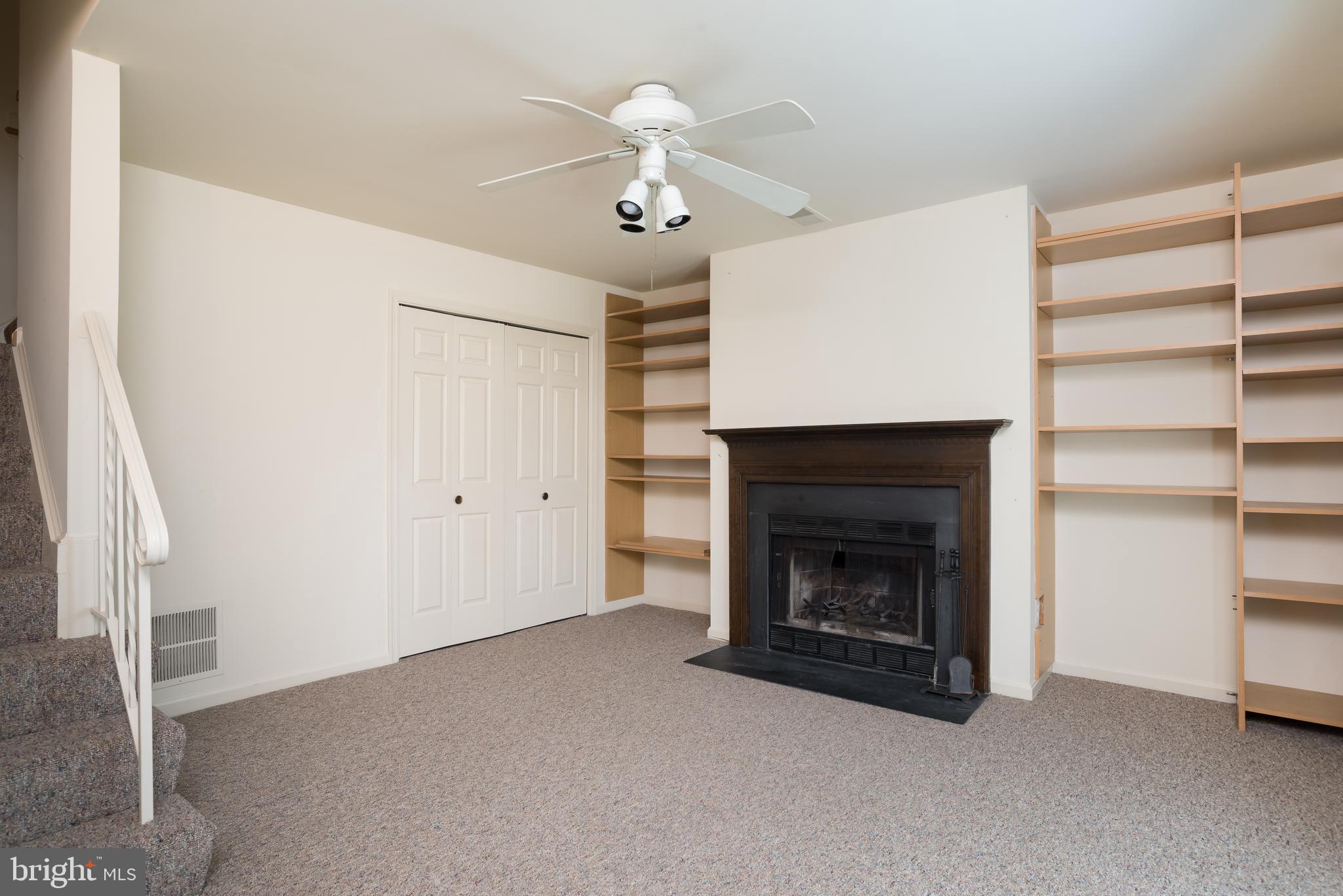 950 South Rolfe Street Arlington, VA 22204 - Photo 7 of 30 Rec Room with Fireplace & Built In Shelves
