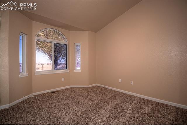 11625 Rex Road Peyton, CO 80831 - Photo 27 of 36 bedroom on the main level, freshly painted, new carpet and pad