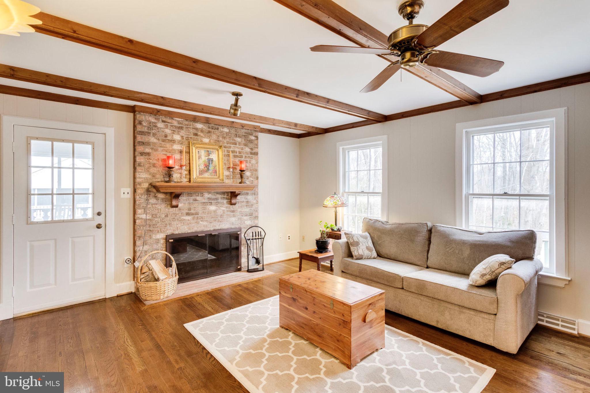 2825 Rifle Ridge Road Oakton, VA 22124 - Photo 14 of 53 Family room with hardwood floors and fireplac
