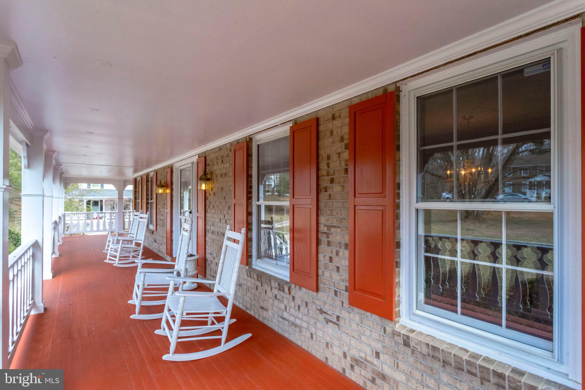 2825 Rifle Ridge Road Oakton, VA 22124 - Photo 6 of 53 Front porch leading you to a screened in porch