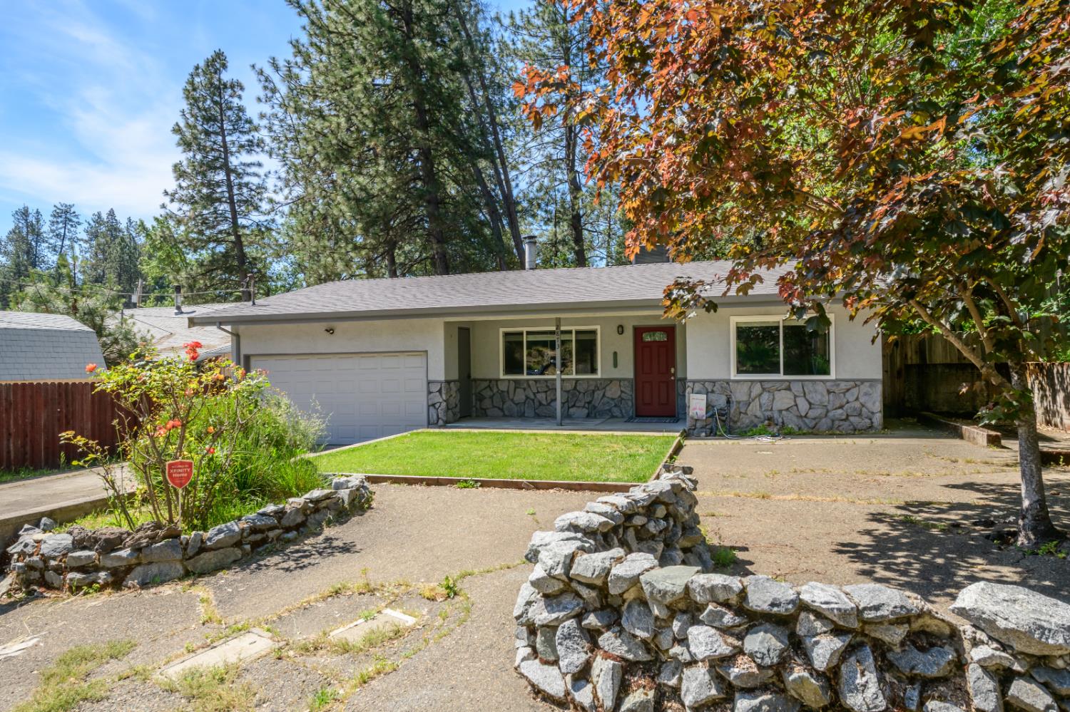 2873 Anderson Way Placerville, CA 95667 - Photo 1 of 24 a front view of a house with a yard and garage