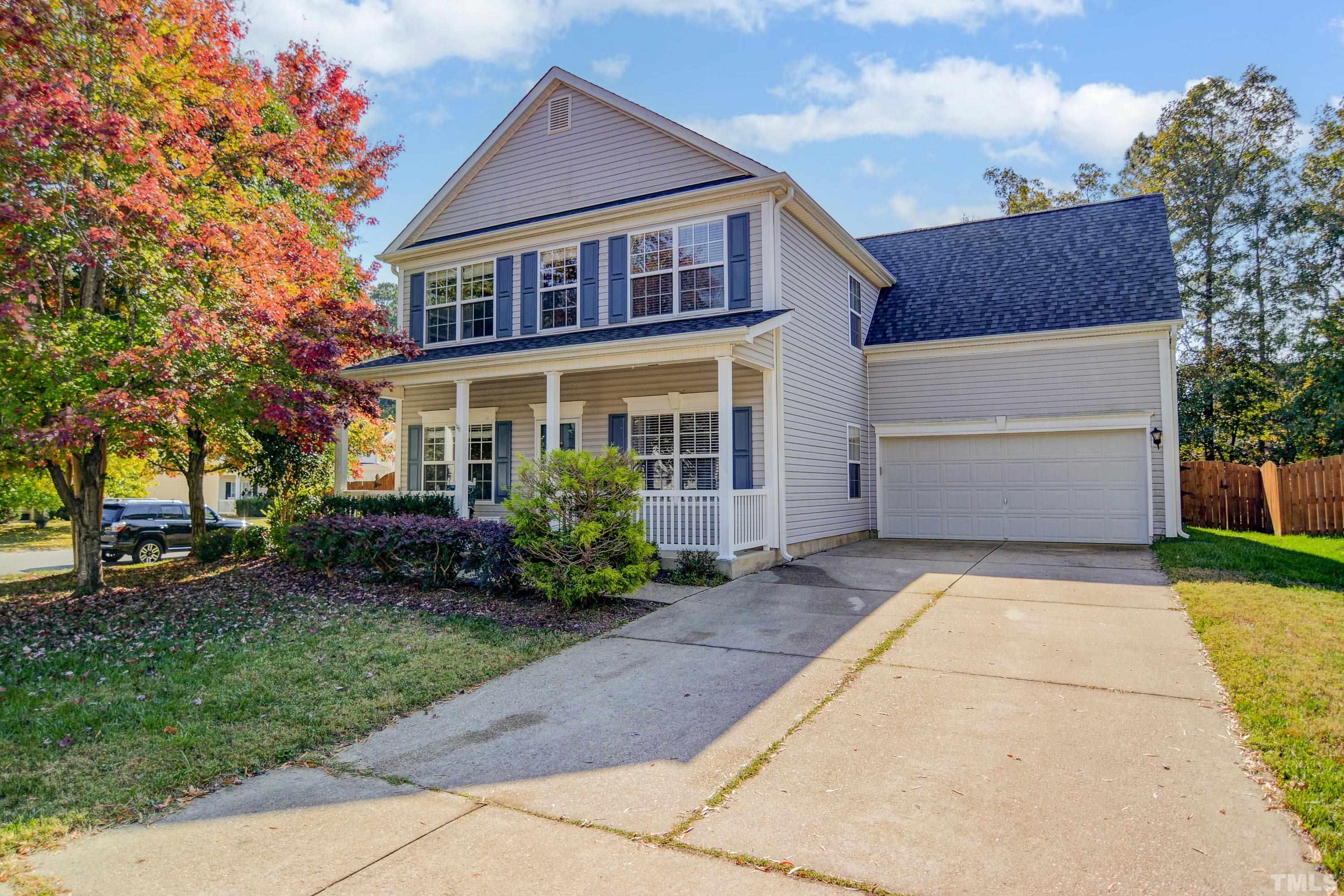 5424 Neuse Forest Road Raleigh, NC 27616 - Photo 1 of 30 a front view of a house with a yard and a garage