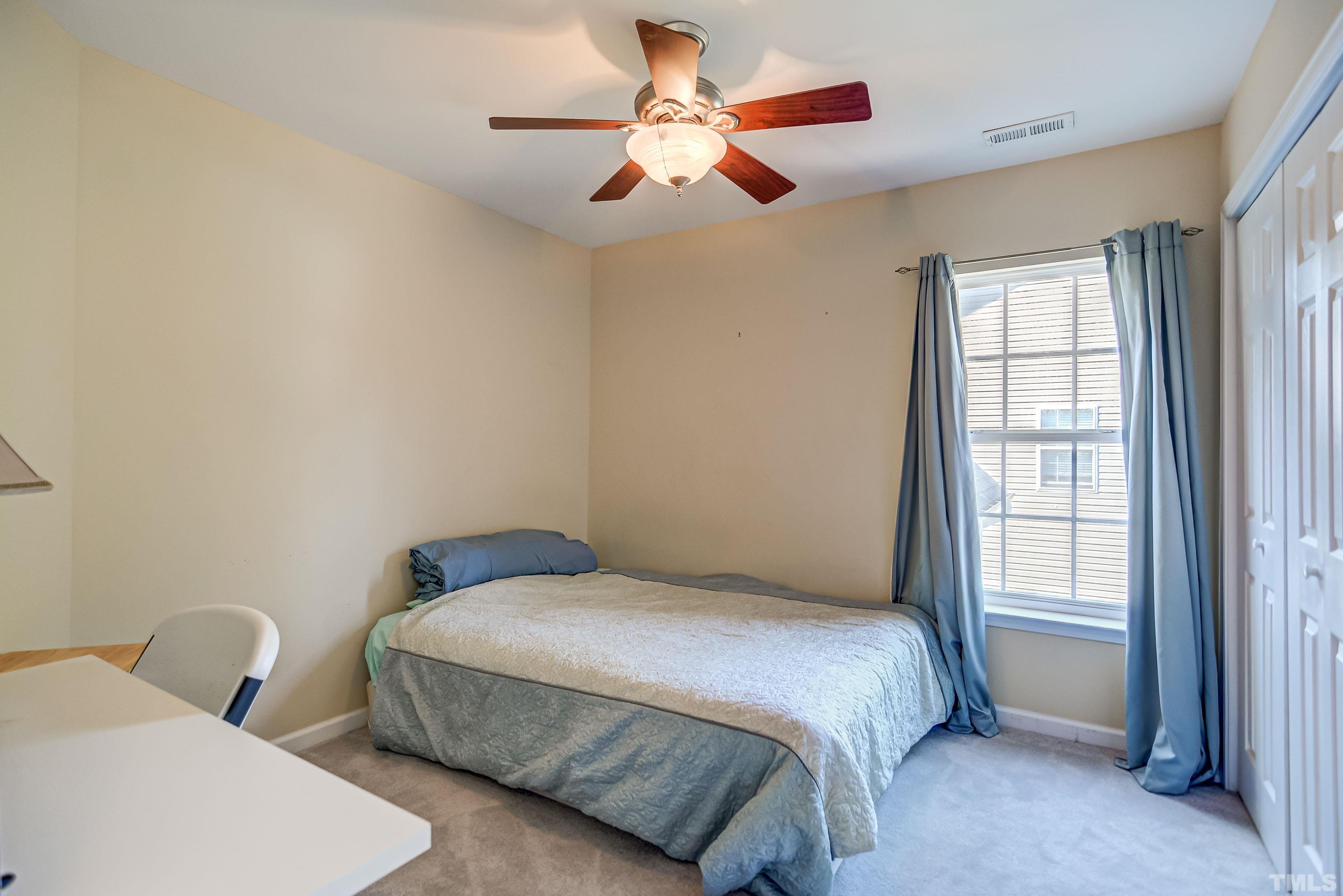 5424 Neuse Forest Road Raleigh, NC 27616 - Photo 20 of 30 a bedroom with bed and window