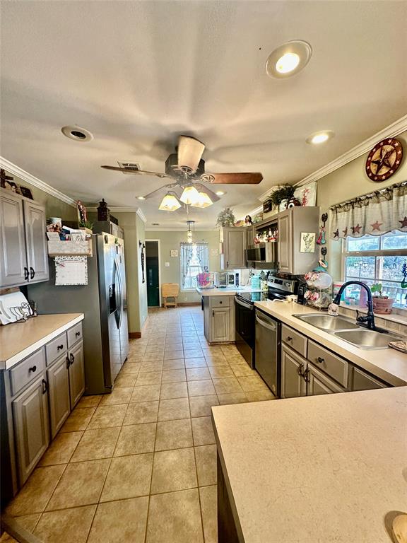 2620 North State Highway 37 Quitman, TX 75783 - Photo 13 of 27 a large kitchen with stainless steel appliances lots of counter space and windows
