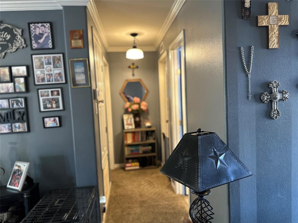 2620 North State Highway 37 Quitman, TX 75783 - Photo 14 of 27 a living room with wall paintings and a painting on the wall