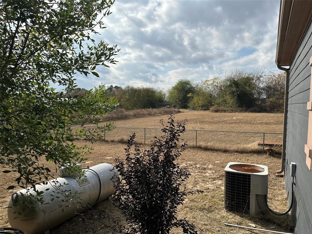 2620 North State Highway 37 Quitman, TX 75783 - Photo 24 of 27 a view of a backyard with plants and a patio