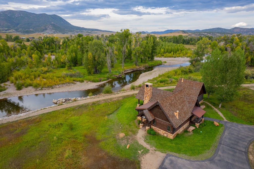 27095 Fire Song Road Steamboat Springs, CO 80487 - Photo 21 of 39 an aerial view of a house with garden space and outdoor seating