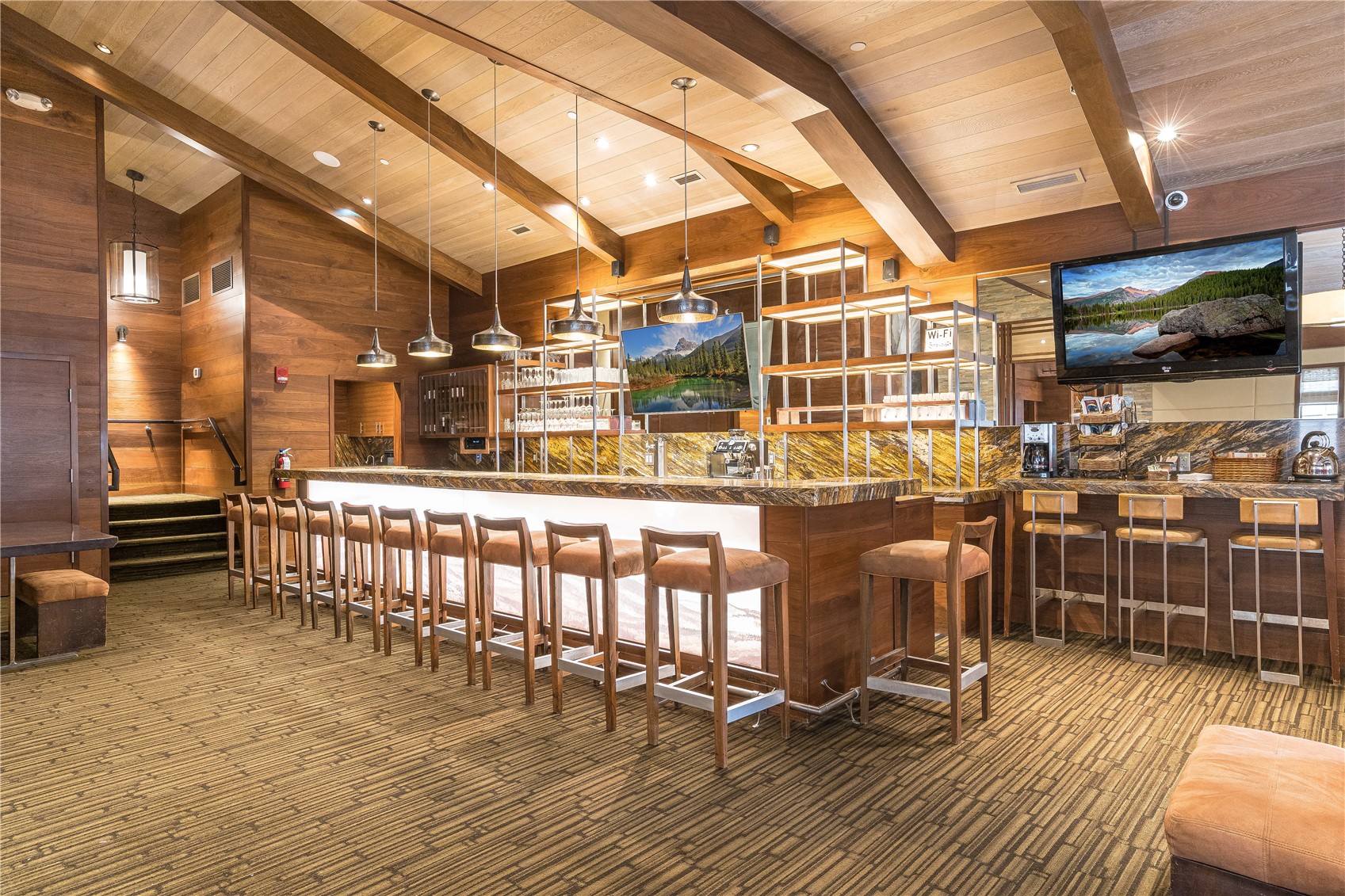 27095 Fire Song Road Steamboat Springs, CO 80487 - Photo 22 of 39 a view of a swimming pool with a chairs and wooden floor