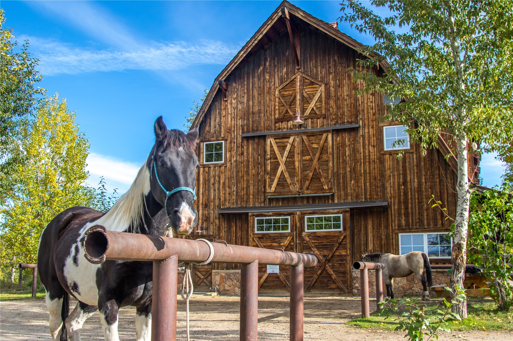 27095 Fire Song Road Steamboat Springs, CO 80487 - Photo 27 of 39 a view of a house with backyard and patio