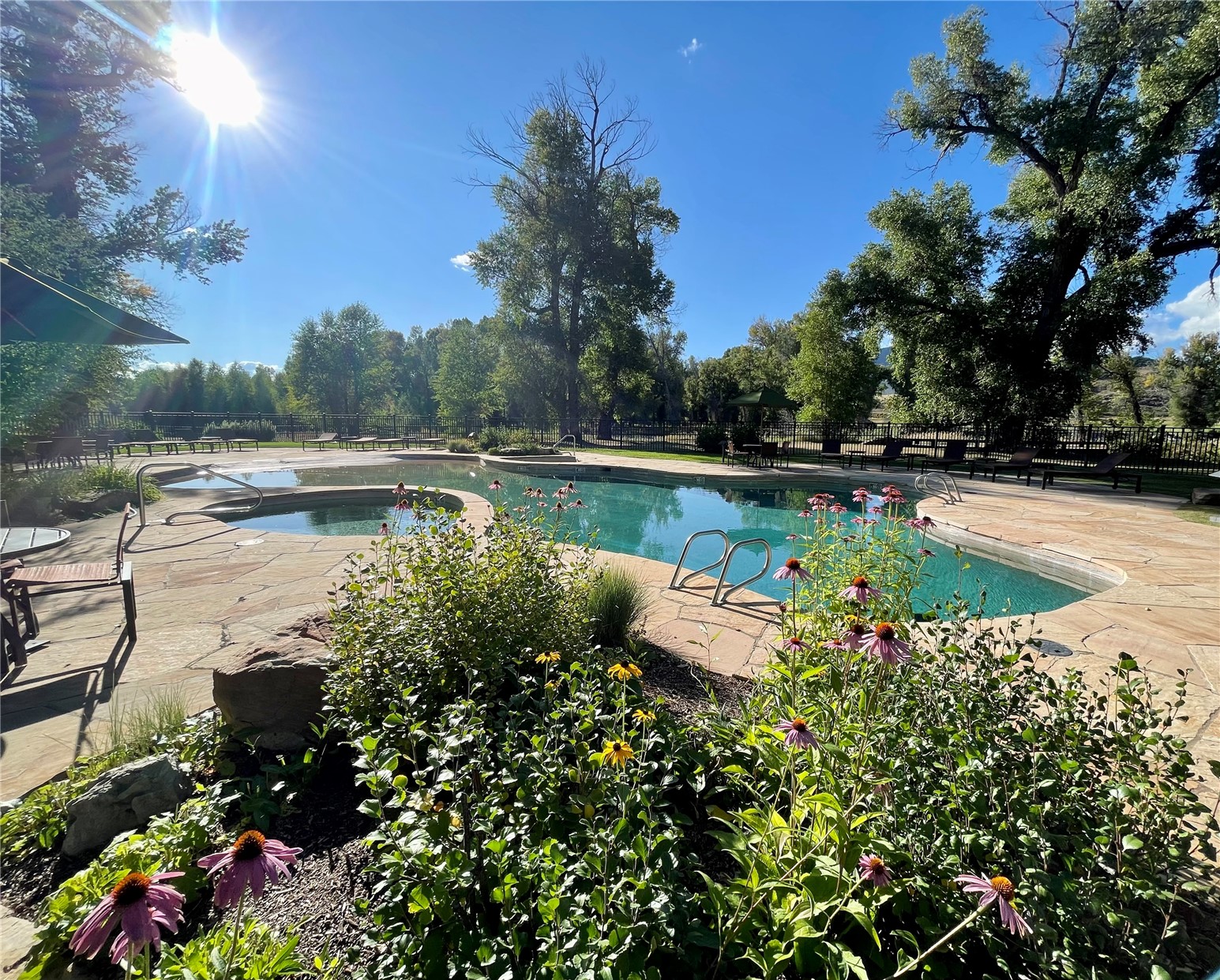 27095 Fire Song Road Steamboat Springs, CO 80487 - Photo 35 of 39 a view of a lake with a house in the background
