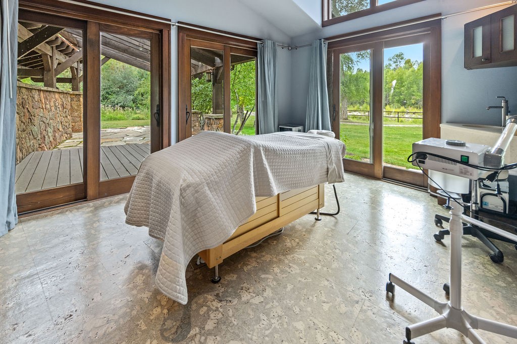 27095 Fire Song Road Steamboat Springs, CO 80487 - Photo 7 of 39 a bed sitting in a bedroom next to a window