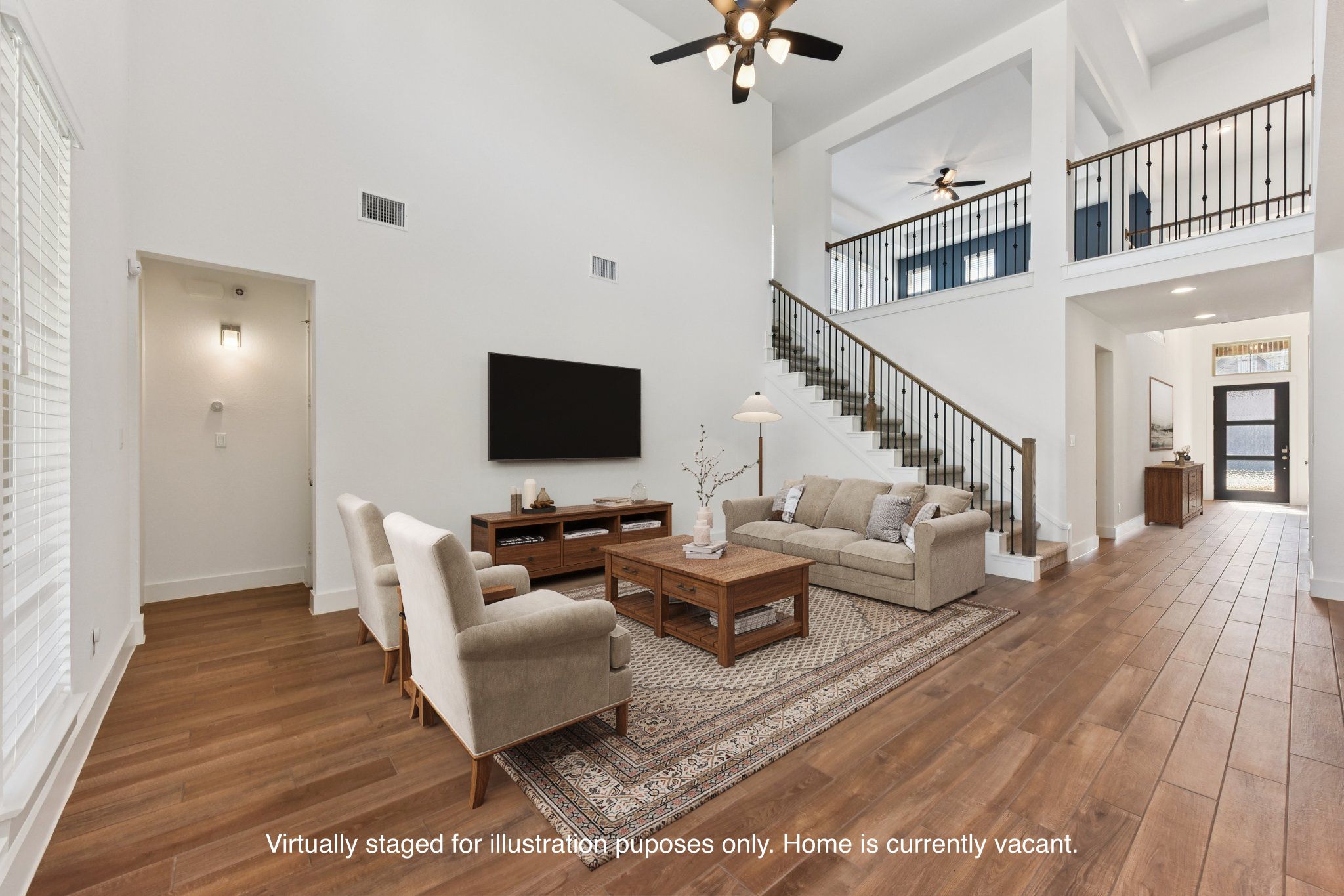 225 Ashmore Lane Georgetown, TX 78628 - Photo 35 of 36 Light and bright open floor plan. 2-story soaring ceilings in the living room. (Virtually staged for illustration purposes only)