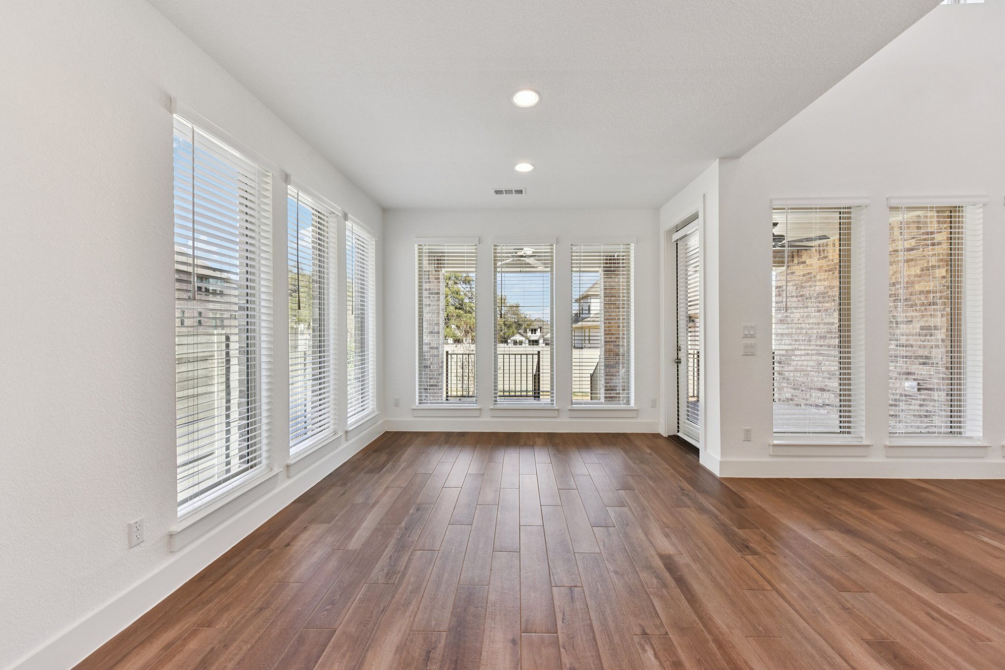 225 Ashmore Lane Georgetown, TX 78628 - Photo 10 of 36 Dining area is surrounded by floor to celing windows, Large enough for holiday dinners. Notice no direct house behind the windows, just a beautiful tree!