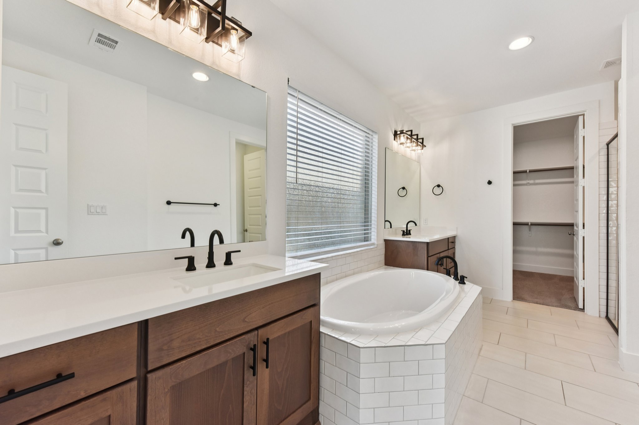 225 Ashmore Lane Georgetown, TX 78628 - Photo 15 of 36 Relax at the end of a long day in the soaking tub. And don't forget the extra large walk-in closet