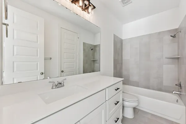 a bathroom with a sink and mirror