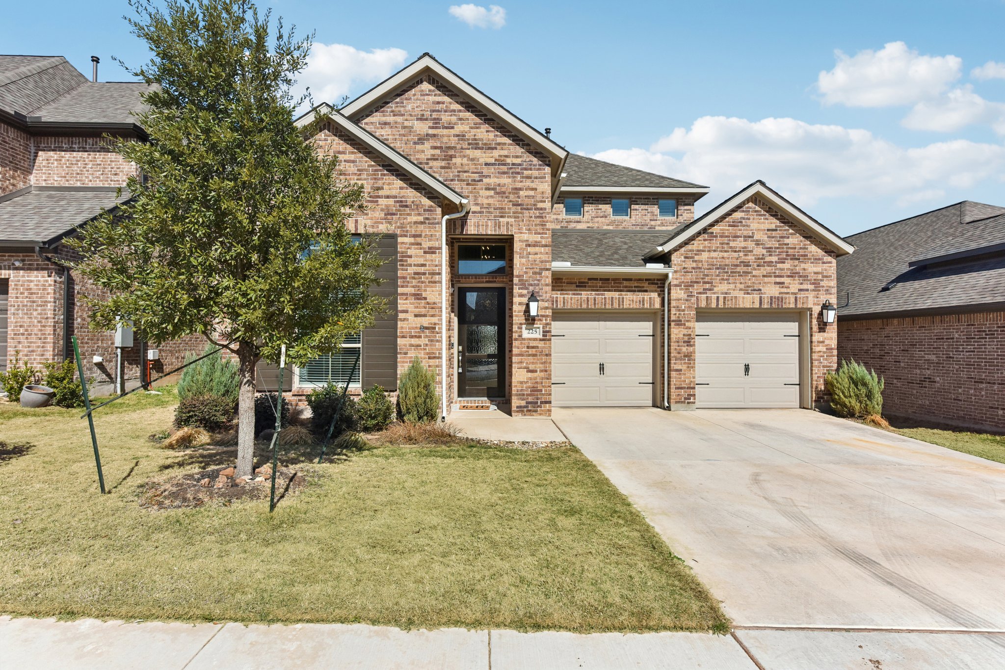 Lovely curb appeal with brick exterior.  3 car tandem garage. High quality Perry builders